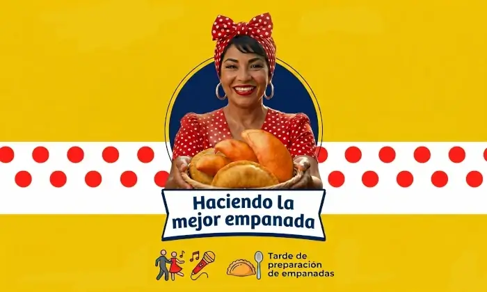 Una mujer sonriente con un pañuelo de puntos rojos en la cabeza sostiene una cesta llena de empanadas doradas. Al fondo, un banner amarillo y blanco promociona el evento "Haciendo la mejor empanada" en Metrosol